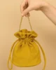 Bolso bombonera de antelina mostaza