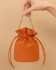 Bolso bombonera de antelina naranja