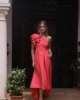 Vestido midi asimétrico con tablas coral Vestido midi asimétrico con tablas coral