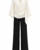Conjunto negro de pantalón y blusa de gasa cruda Conjunto negro de pantalón y blusa de gasa cruda